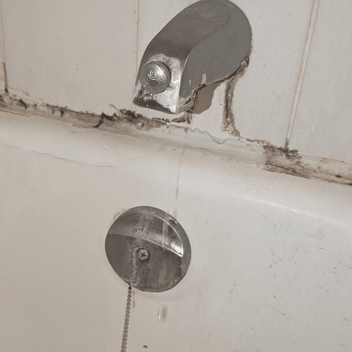 Old faucet being removed during replacement process