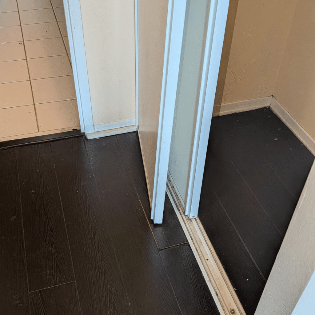 New flooring planks being installed for a smooth surface