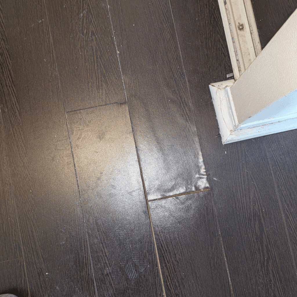 Damaged flooring being repaired and replaced