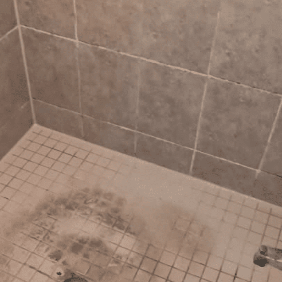 Applying caulking to seal gaps in bathroom or kitchen