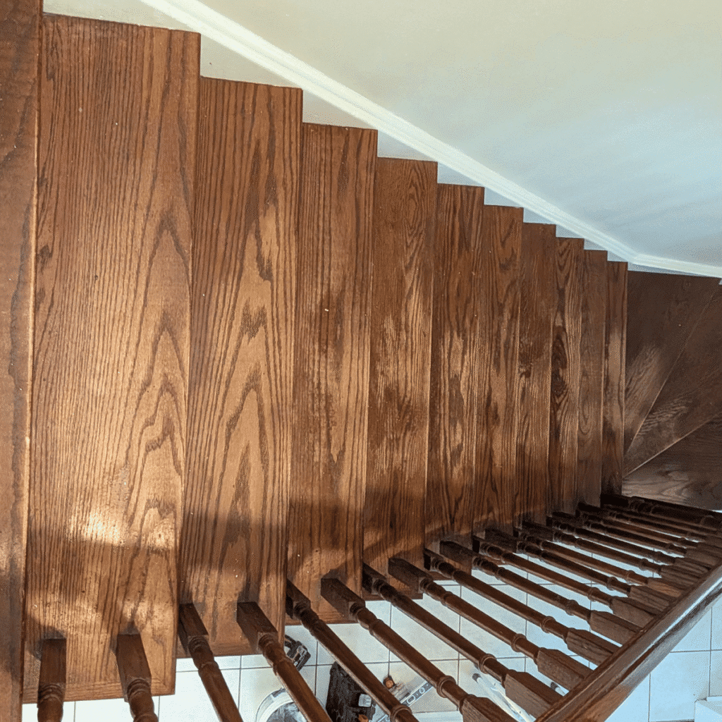 Wooden stairs being sanded and refinished for a smooth surface