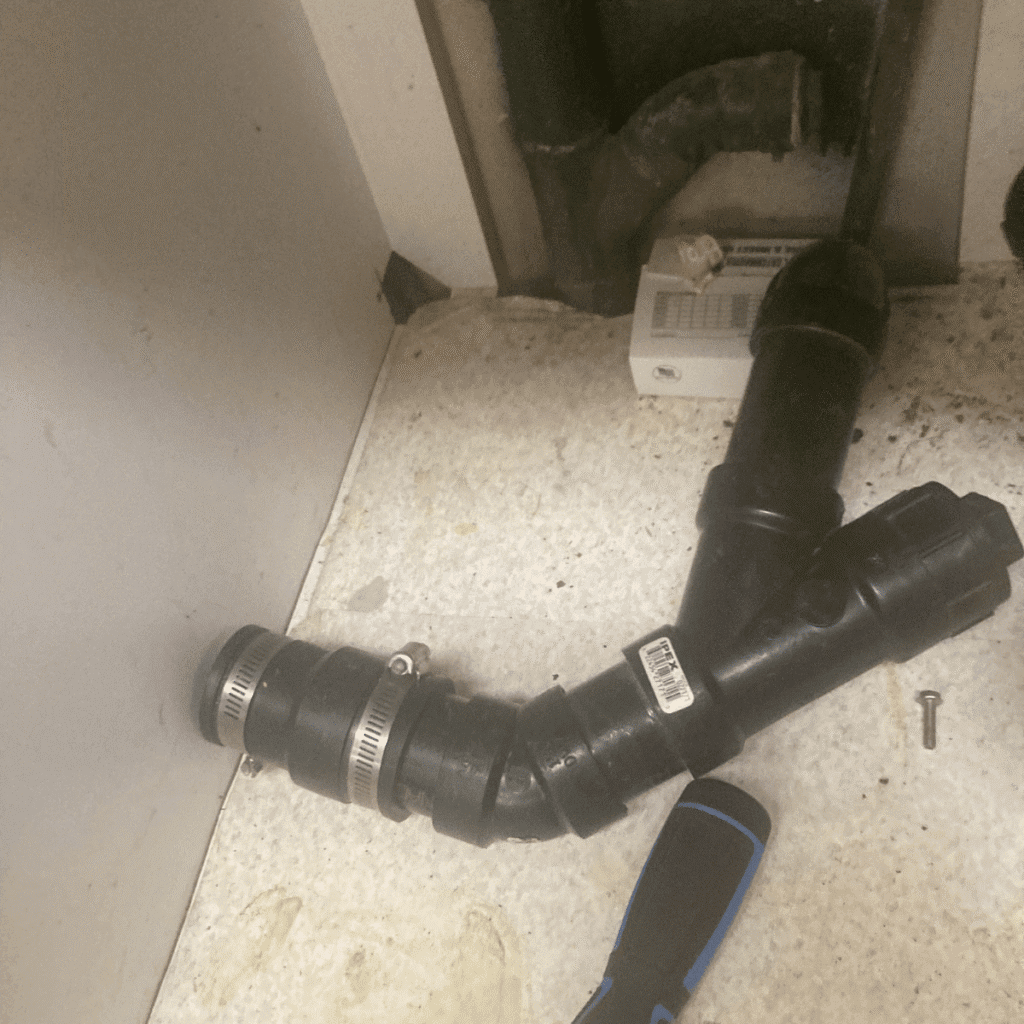 New P-trap installed under kitchen sink with proper fittings