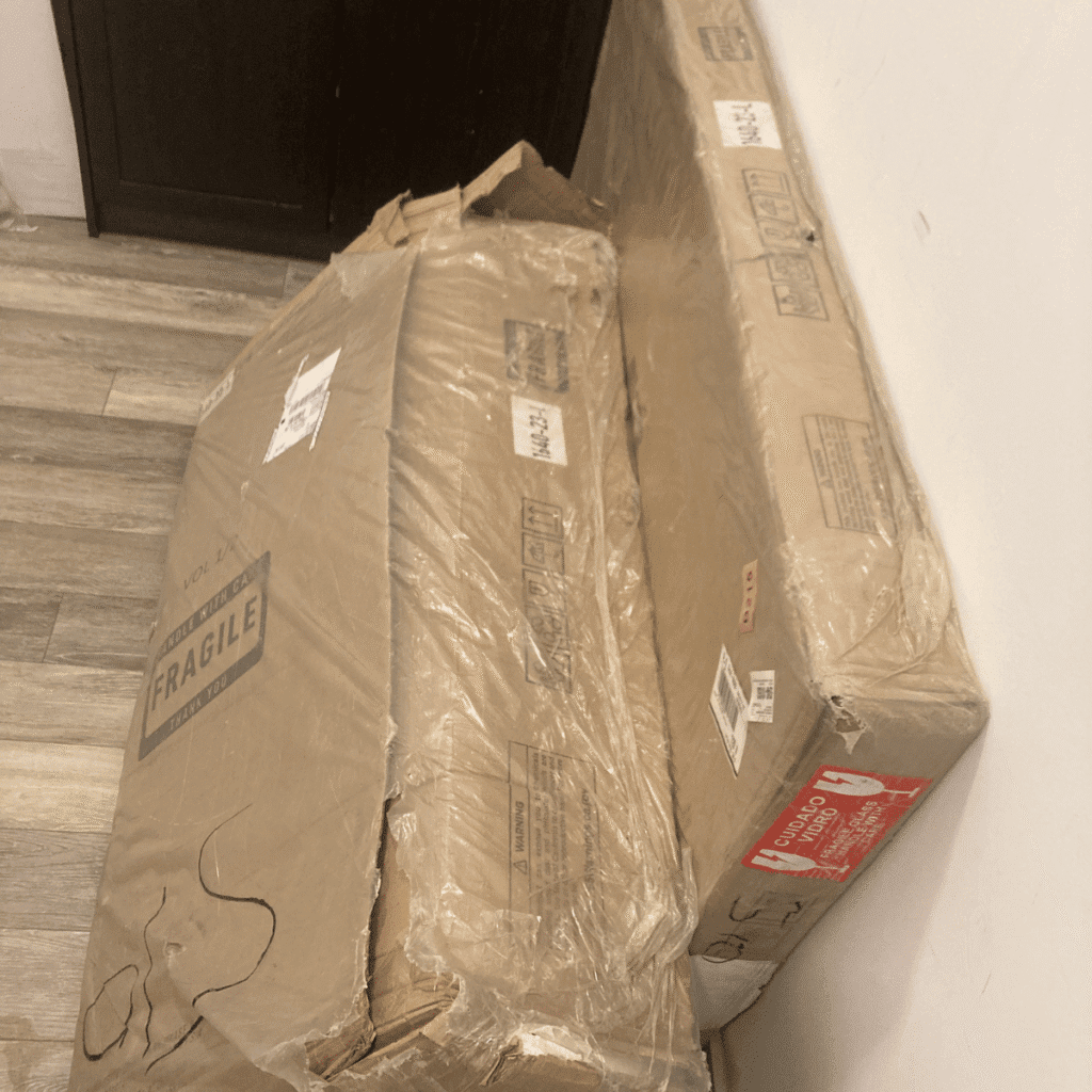 Makeup vanity being assembled with drawers and mirror