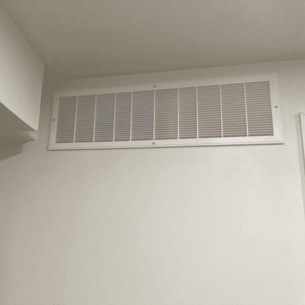 Installing ventilation grill on wall opening