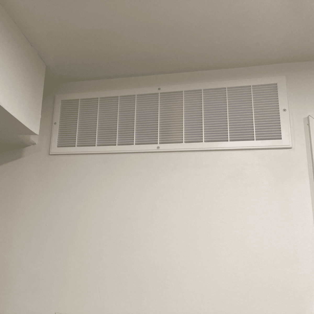 Installing ventilation grill on wall opening