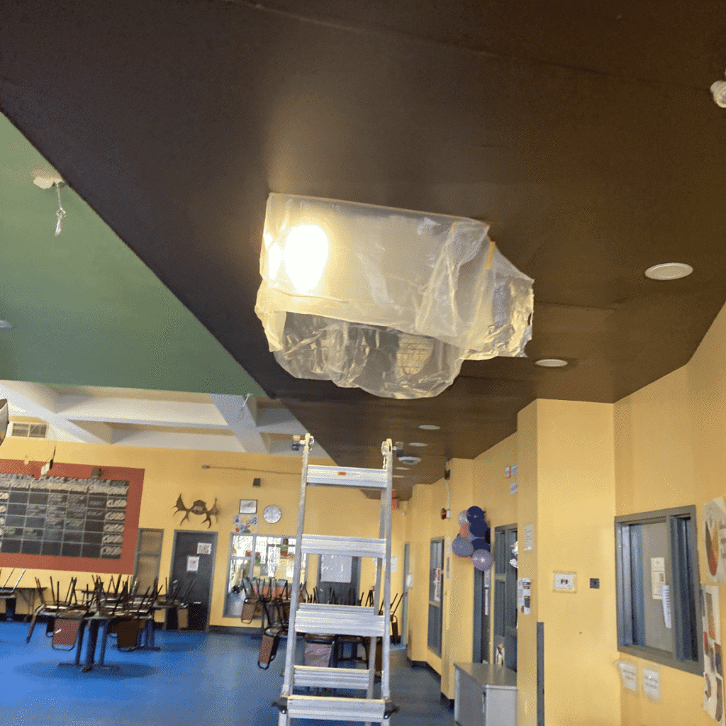 Protective covering placed on floor and furniture during ceiling work