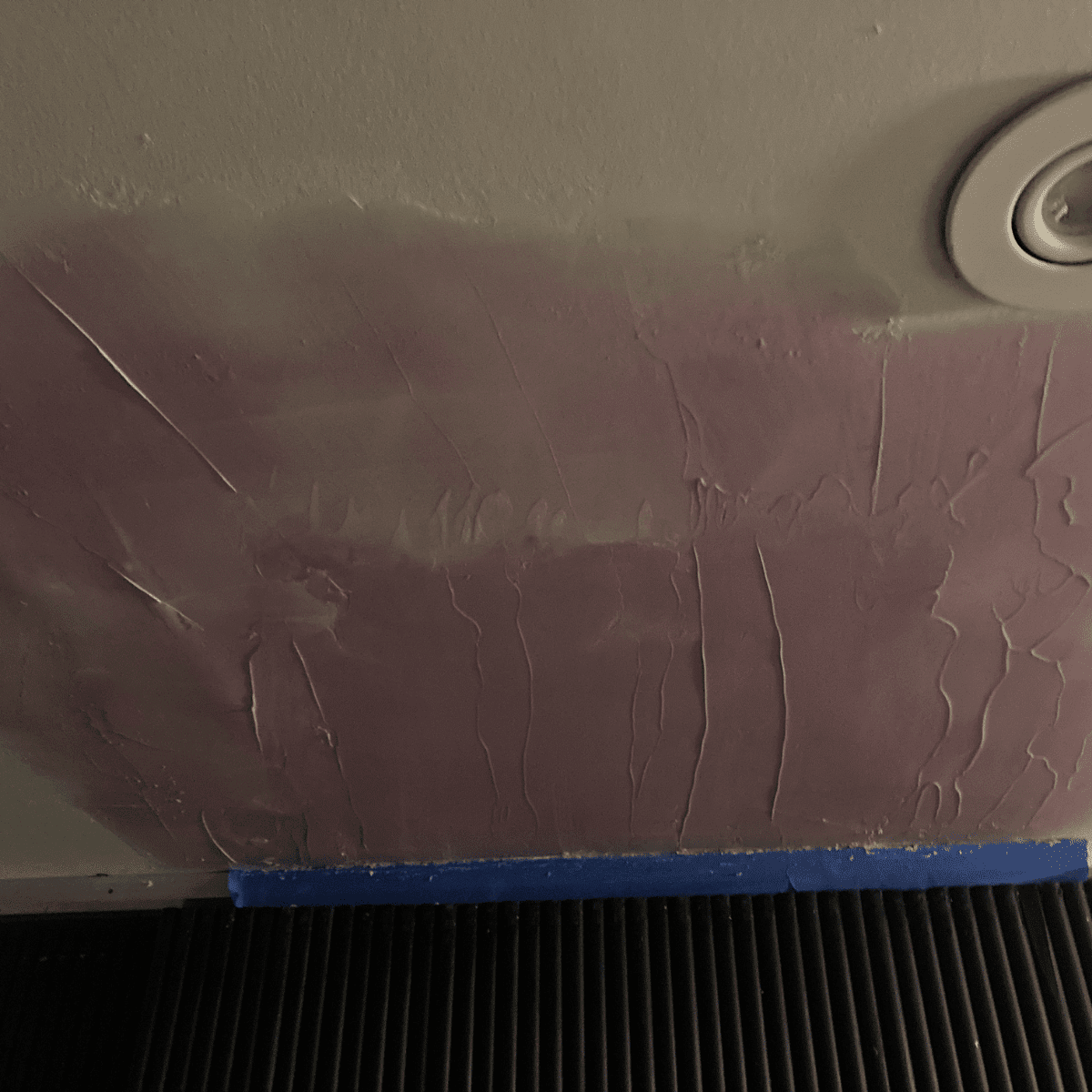 cracked ceiling damaged drywall visible before repair
