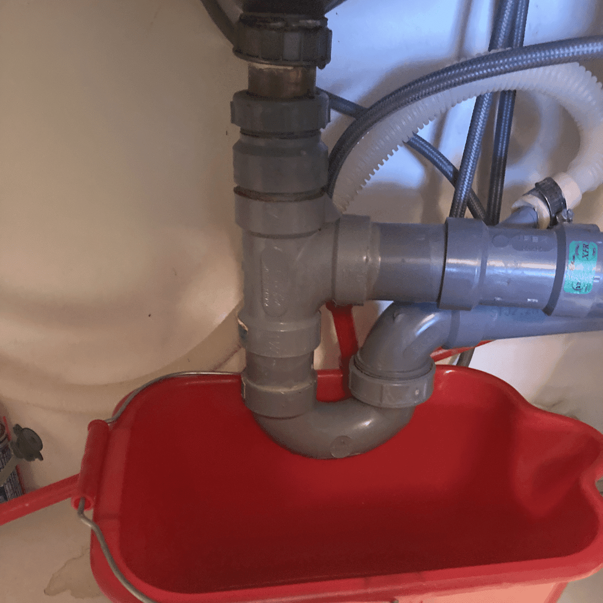 kitchen sink P-trap installation plumbing under sink clean setup