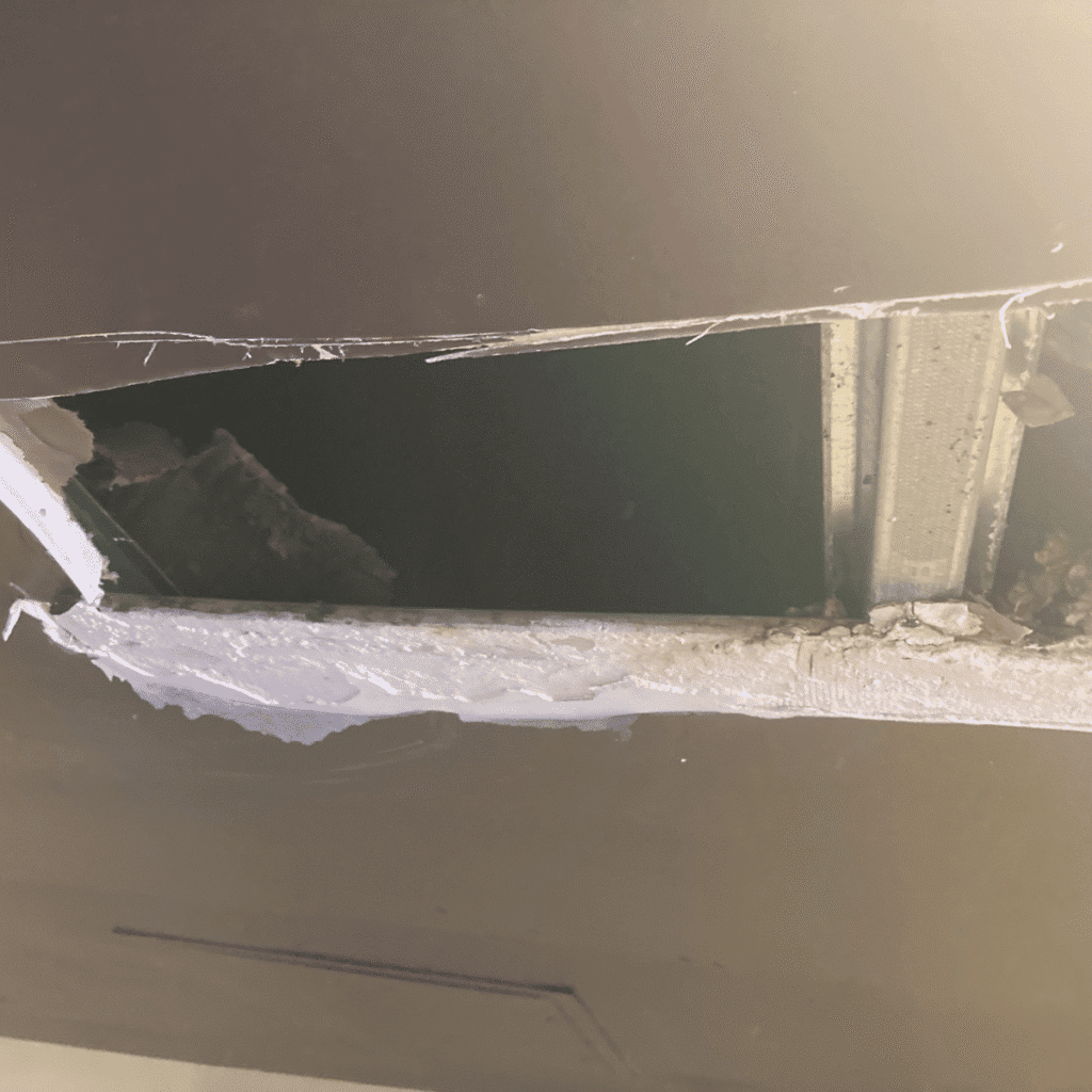 Ceiling plastering project in progress with surface repair