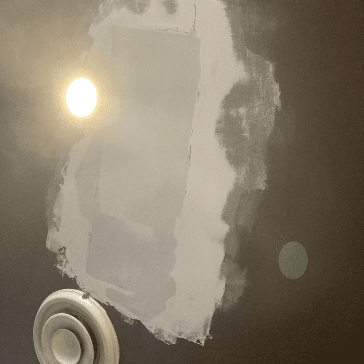 Worker performing ceiling plastering for a smooth result