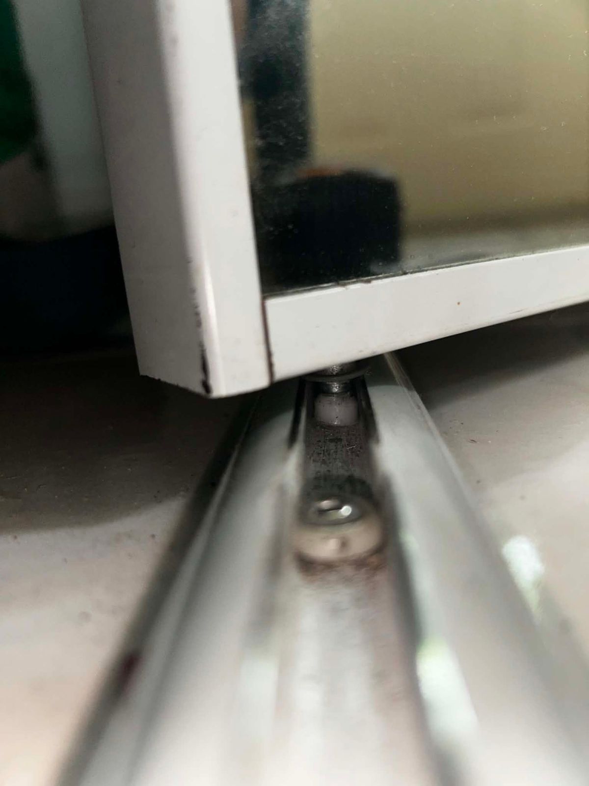 Bifold mirrored closet door repair in North York — roller reseated on track