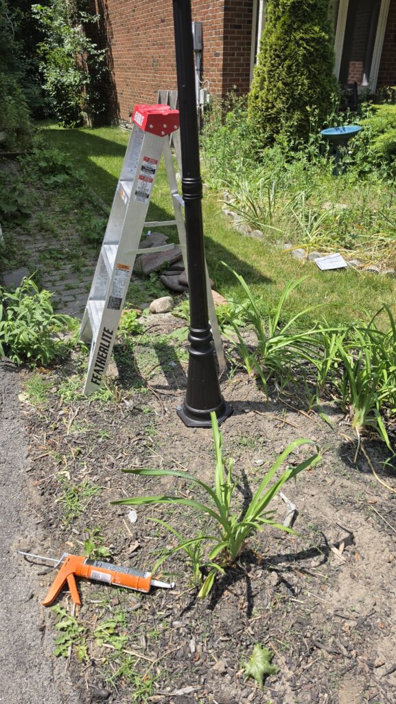Garden lamp post and landscape lighting cables during an outdoor wiring cleanup in Thornhill