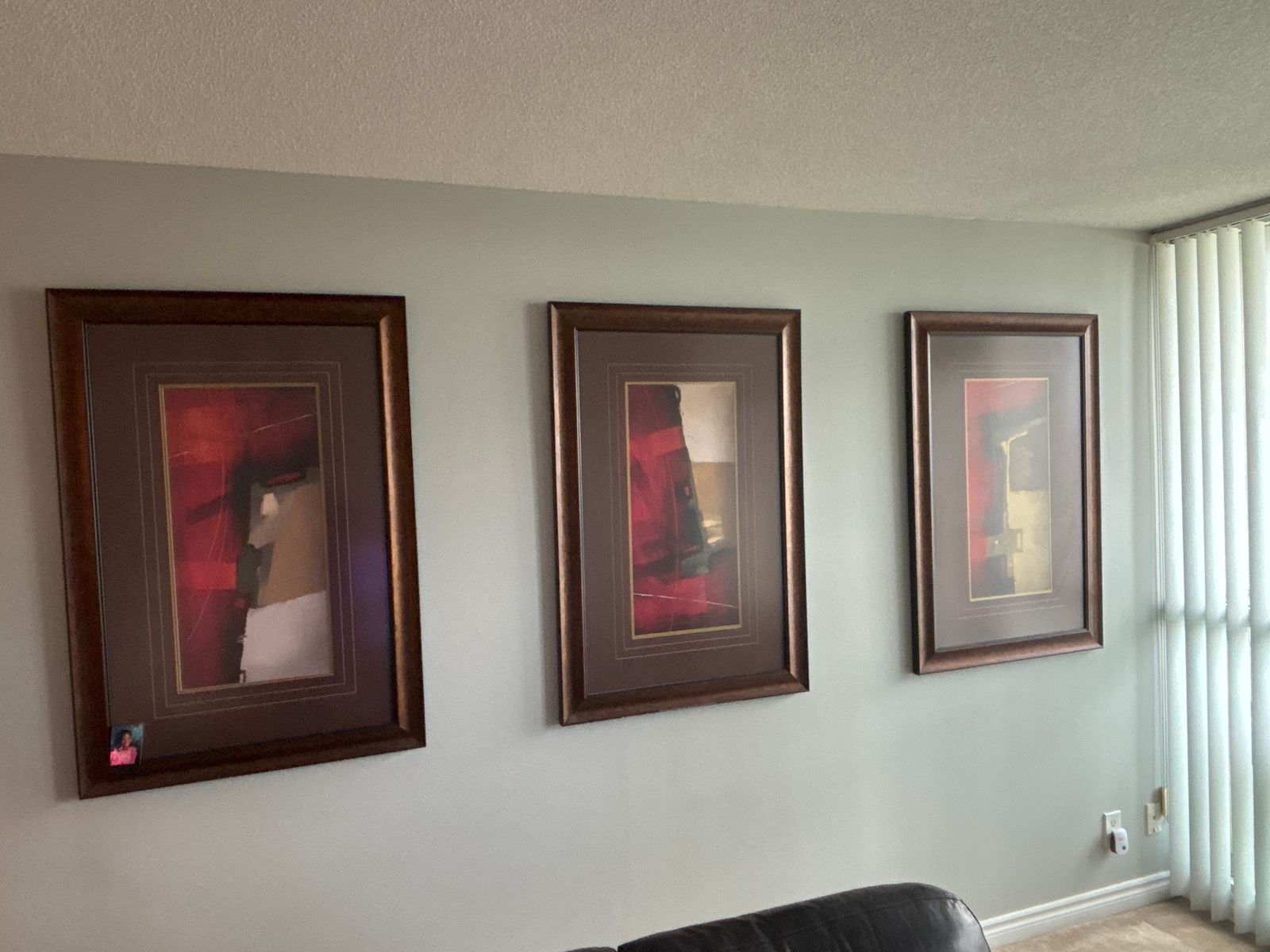Picture hanging in Toronto - leveled gallery wall with frames and mirror