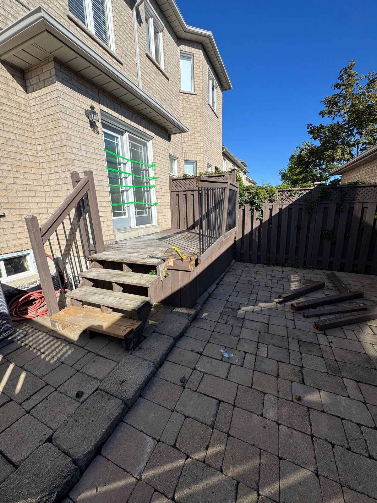 Weathered deck boards and stair treads removed during a deck repair project