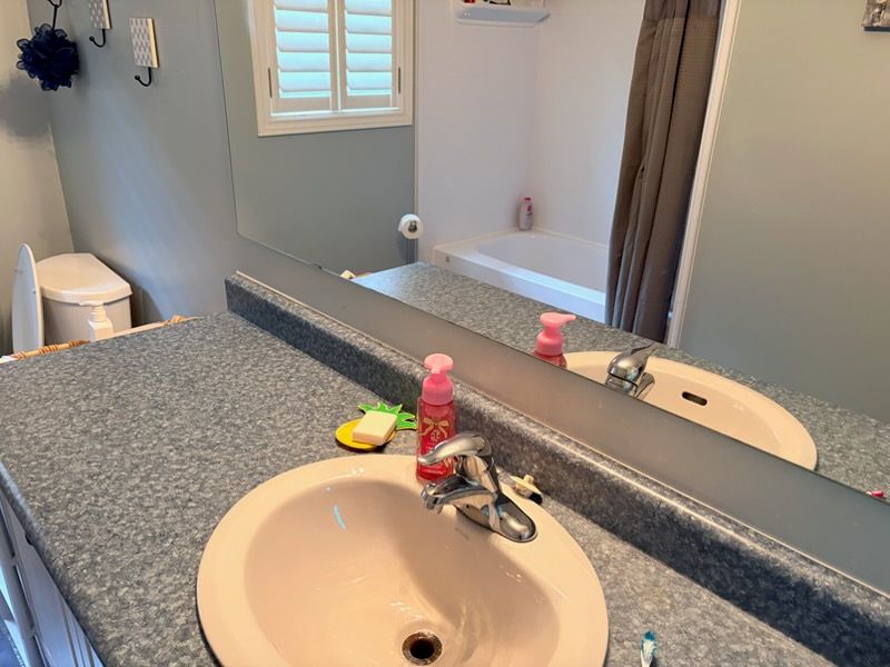 Bathroom vanity countertop and oval sink in a Toronto home during a vanity installation assessment