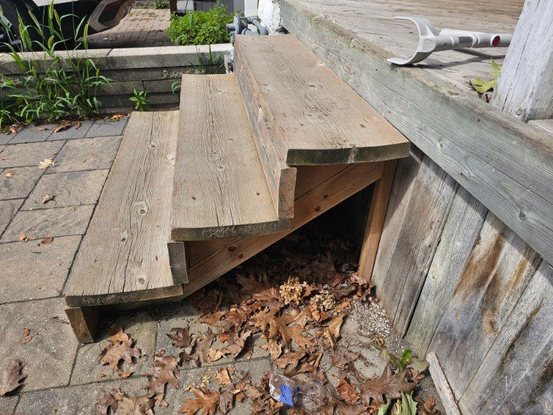 Exterior wooden steps with no handrail installed