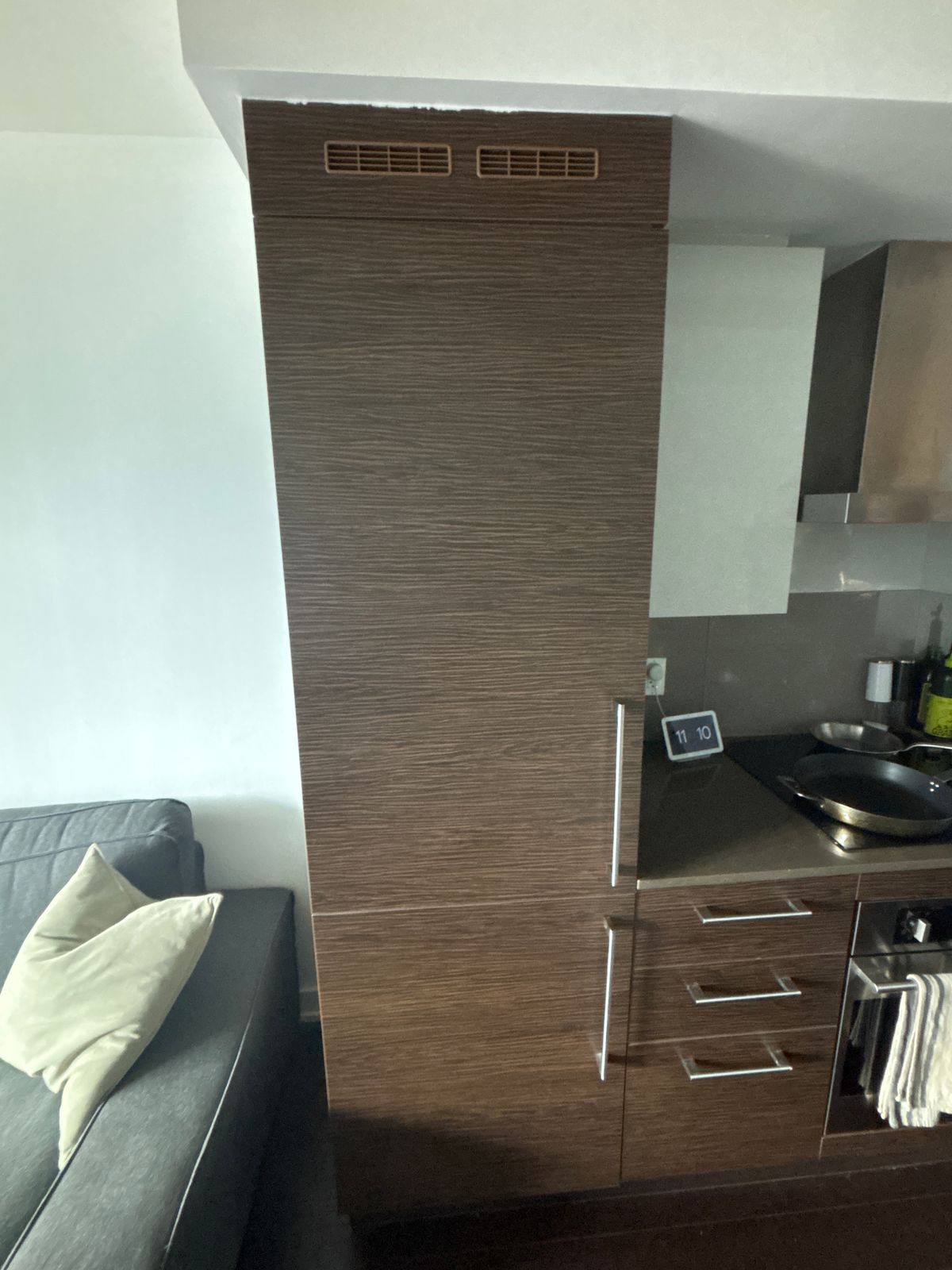 Kitchen cabinet removal cost Toronto – wood fridge surround cabinet panels before removal