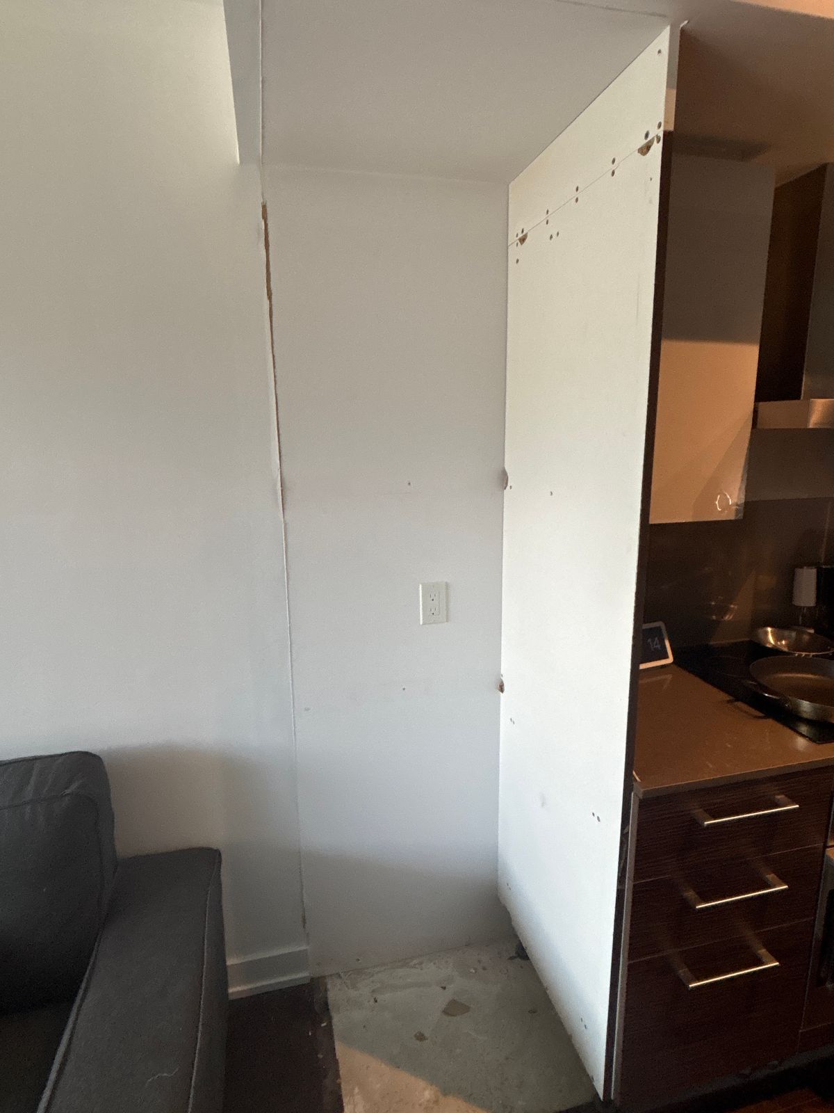 Kitchen cabinet removal cost Toronto – open wall after fridge surround panels were removed