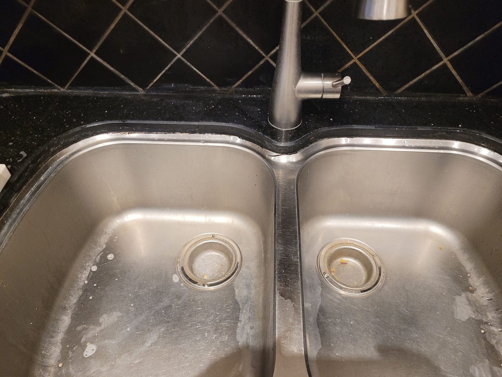 Kitchen sink drain repair Thornhill – double stainless kitchen sink with slow-draining basin