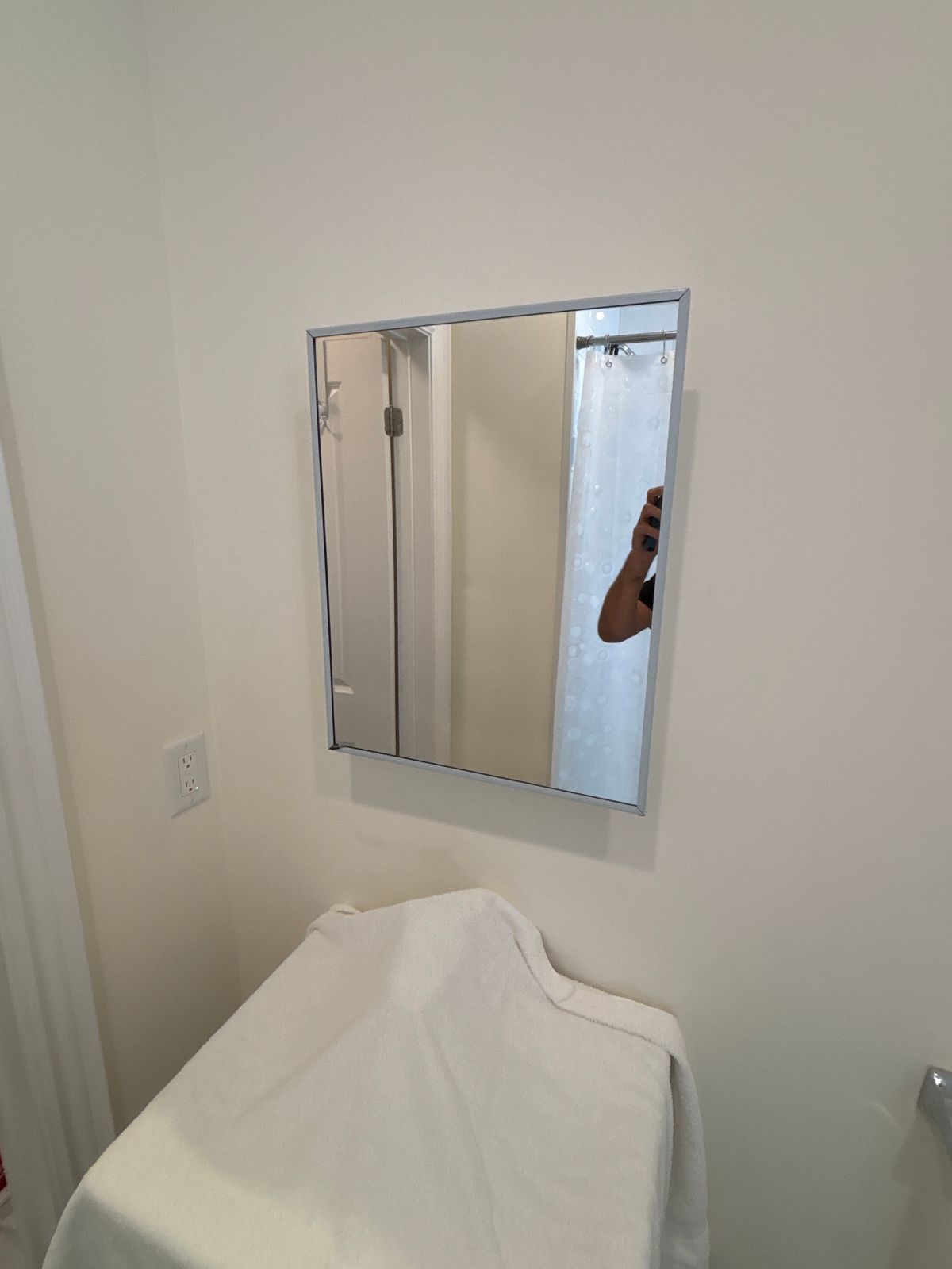 Medicine cabinet installation Toronto – mirrored medicine cabinet mounted above the toilet